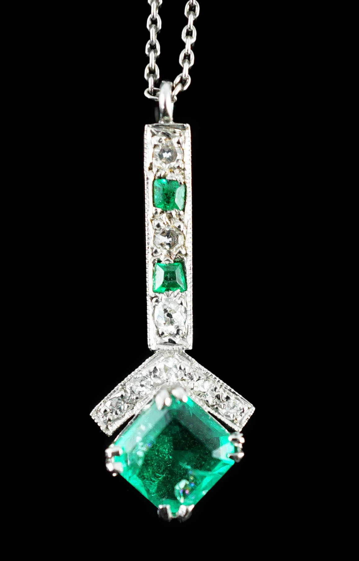 A 1920's platinum?, emerald and diamond set pendant necklace